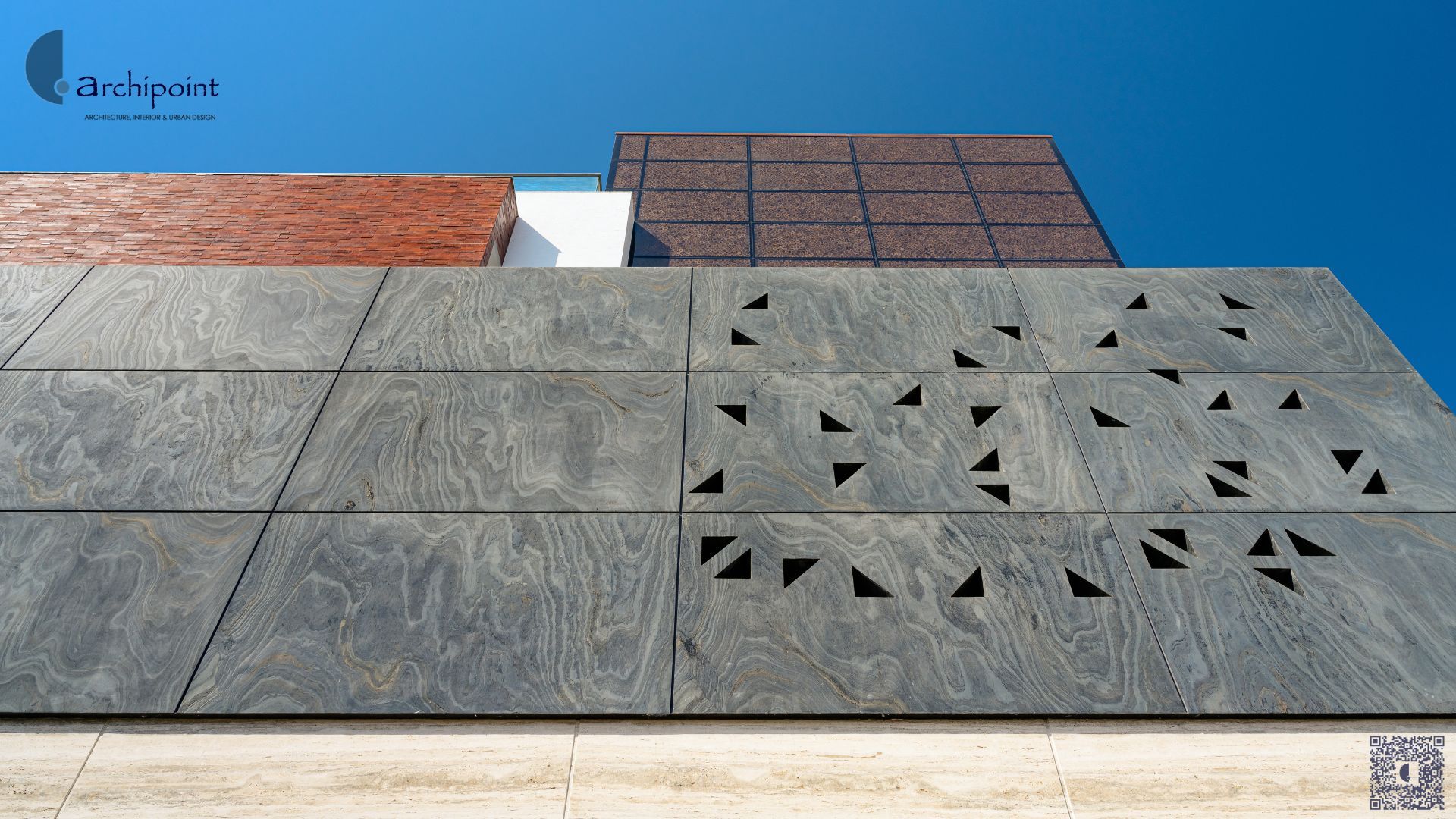 Archipoint featured architecture project Swapna - Modern residential building with textured facade panels and contemporary geometric design in Surat